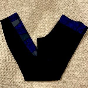 Lululemon black leggings with blue and gray accents.  Great condition